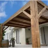 Contemporary style bioclimatic pergola: SUNDIY XL mechanisms in sand beige color with Douglas wood blades
